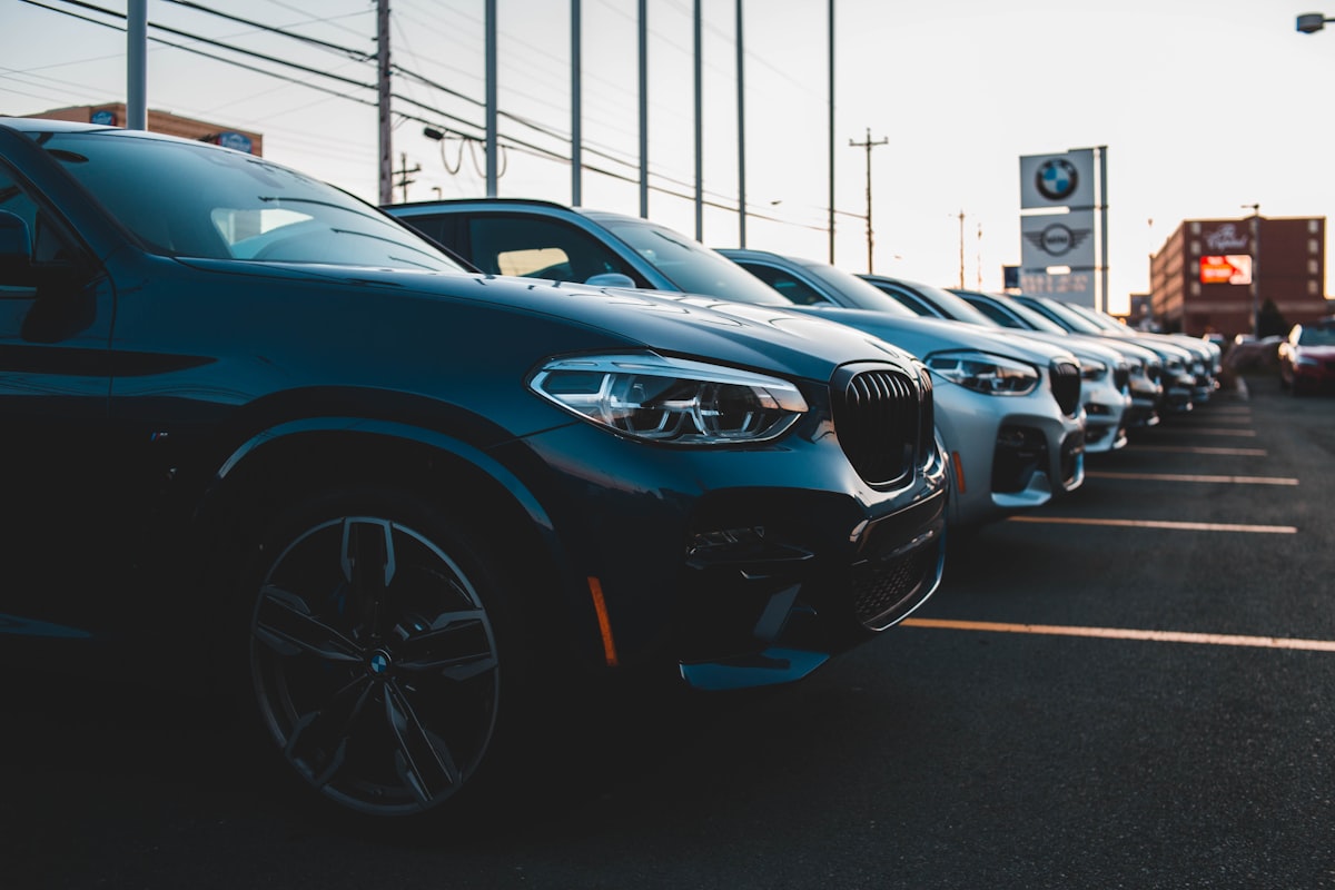 Row of cars at a car dealership forecourt
