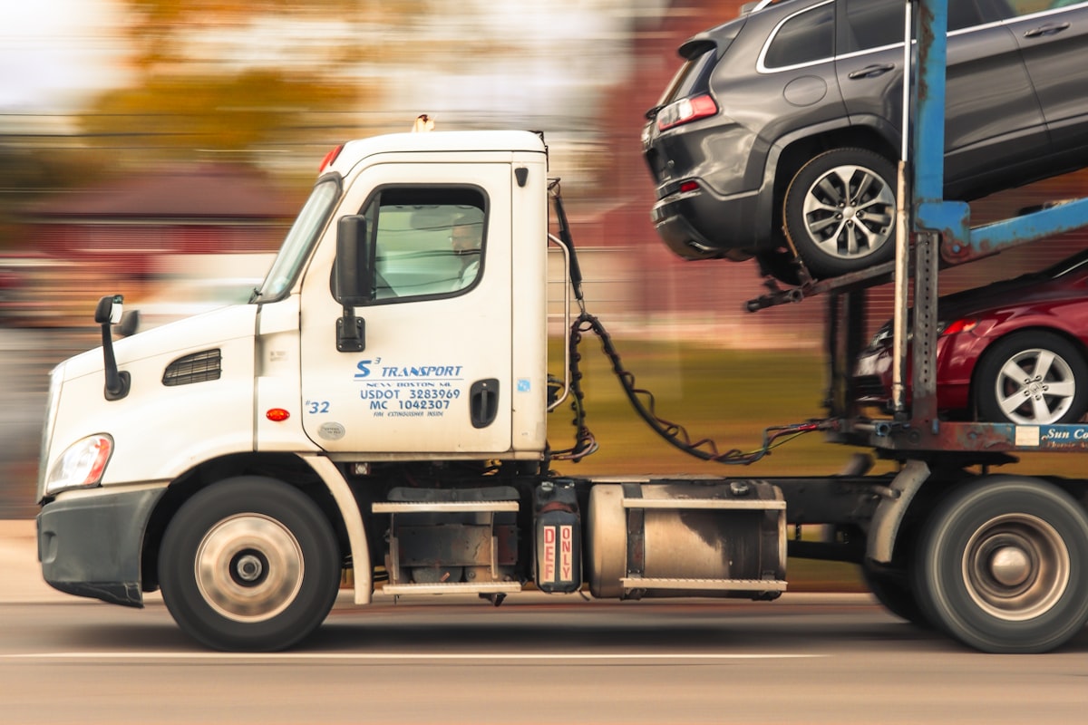 Car carrier truck transporting vehicles on a road